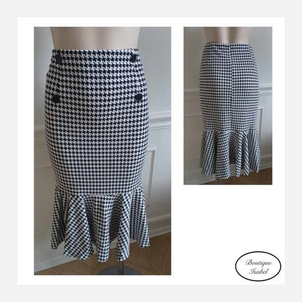 Nederdel i sort/hvid tern pencilskirt med fl�se i bund. 